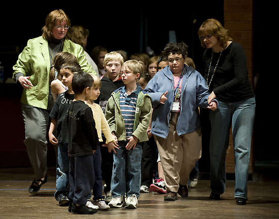 Cast members rehearse with one of the choreographers for The Child